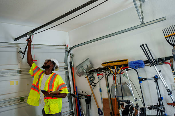 Professional Garage Door Panel Replacement technician working in Clio, AL